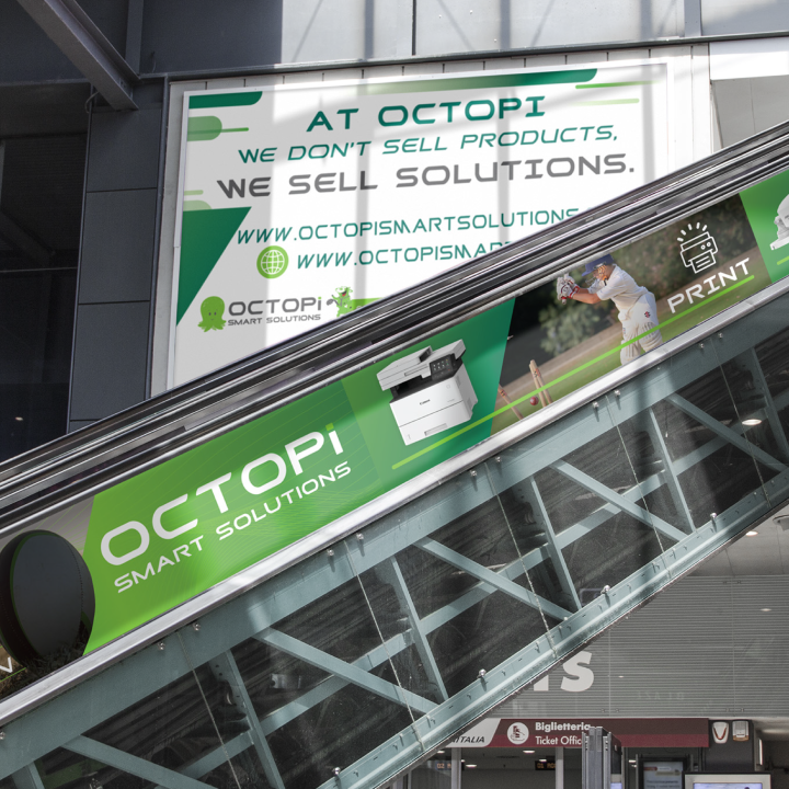 Escalator with advertising panels for OCTOPI Smart Solutions, featuring images of security cameras and printers. Banner above reads: 'We don't sell products, we sell solutions.' Modern, tech-focused tone.